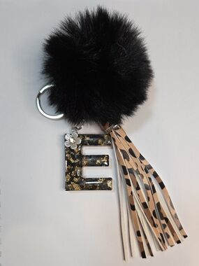 Black Faux Fur Pom Keychain with Gold Fleck 'E' Resin Charm and Leopard Tassel
